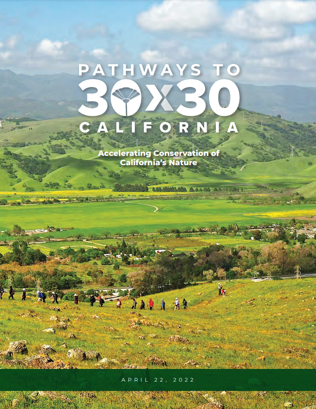 An image of the Pathways to 30x30 California document with people walking in the foreground and green hills in the distance. The sky is blue with a few scattered clouds.